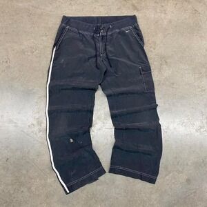 Black Nike cargo pants with white stripe and adjustable waistband‎